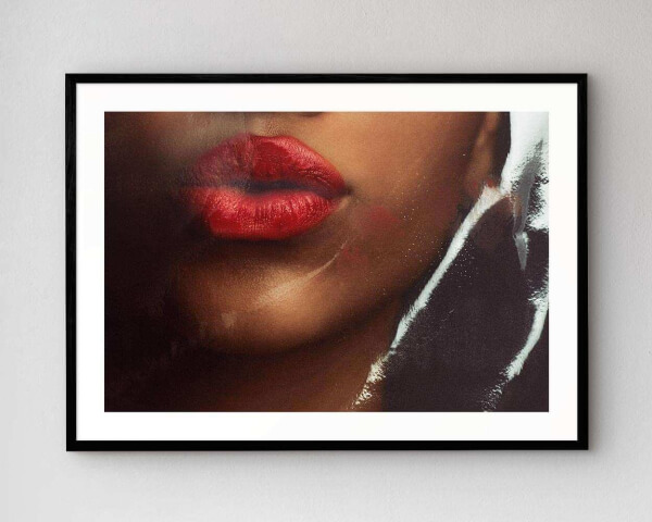 The artwork A Kiss Goodbye mounted in our high-quality wooden frame in black.