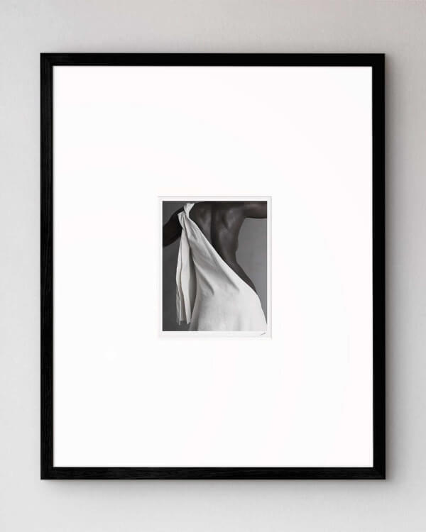The artwork Figure mounted in our high-quality wooden frame in black.