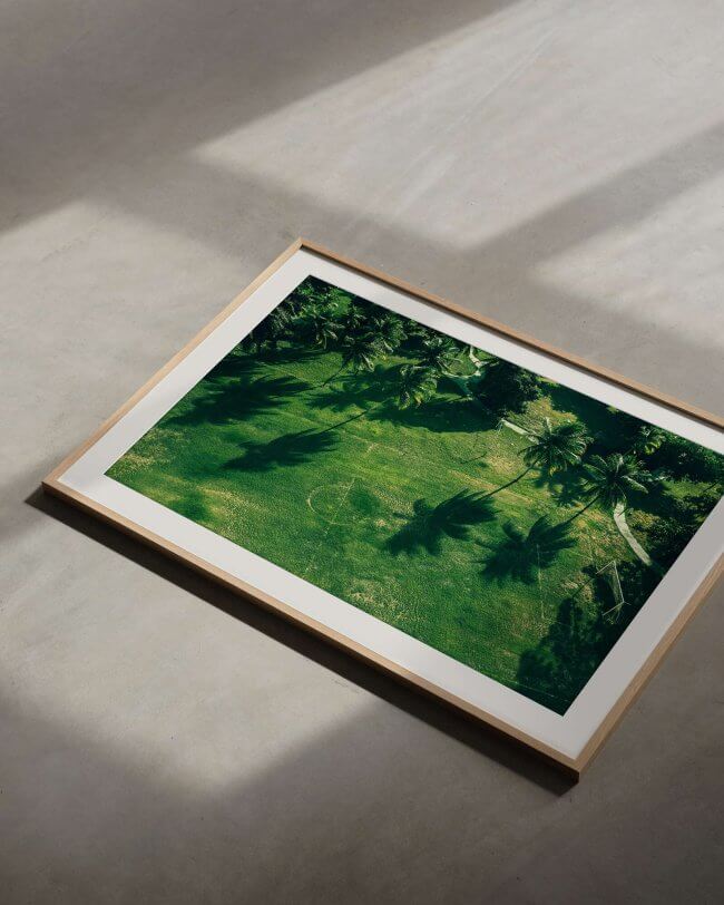 Framed colourful art photography depicting a football field in salvador, brazil in an oak frame