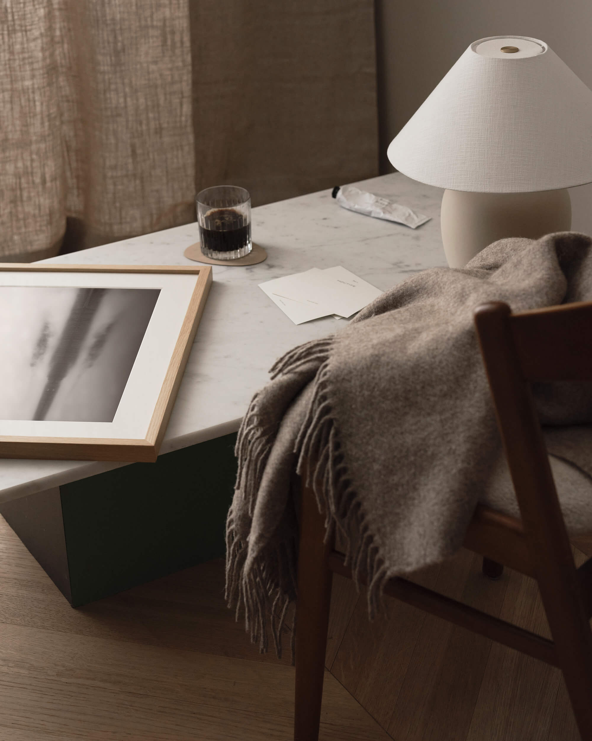 Office desk with scandinavian interior feel with black and white photo art